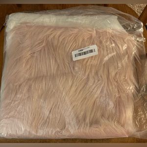 Two very small fuzzy decorative cloth remnants pink and white